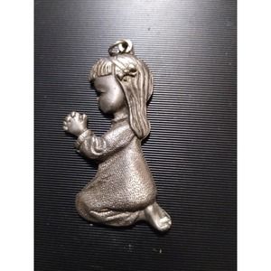 Little Italian girl kneeling in prayer